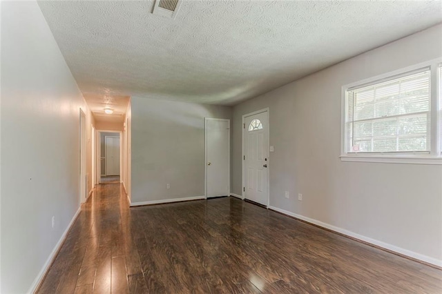 2783 Bicentennial Dr, Stone Mountain, GA 30087 - empty room with wood finished floors and a textured ceiling
