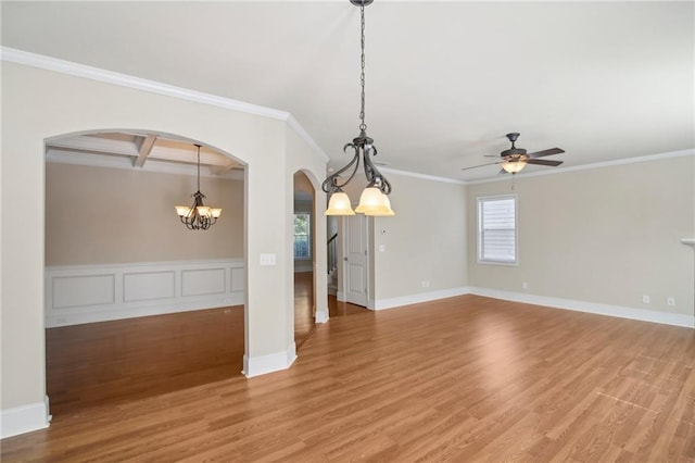 interior space featuring light wood-style floors, arched walkways, coffered ceiling, and crown molding