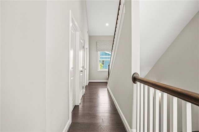 hallway featuring recessed lighting, baseboards, and dark wood-style floors