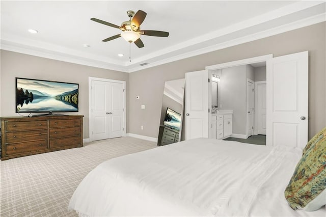 carpeted bedroom with crown molding, recessed lighting, baseboards, and a raised ceiling