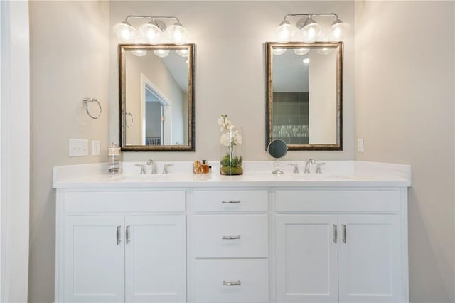 full bath featuring double vanity and a sink
