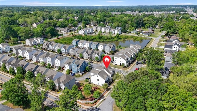 drone / aerial view featuring a water view and a residential view