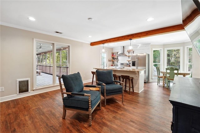 living area featuring plenty of natural light, ornamental molding, dark wood-style floors, and visible vents
