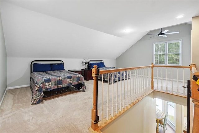 bedroom with baseboards, carpet flooring, and vaulted ceiling
