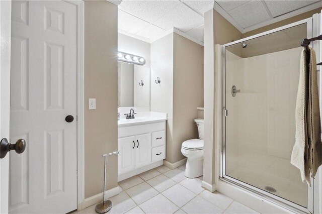 full bath with toilet, tile patterned floors, vanity, and a stall shower
