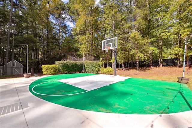 view of sport court with fence and basketball court