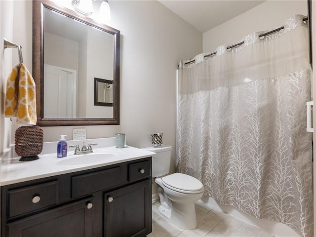 bathroom with tile patterned floors, curtained shower, toilet, and vanity