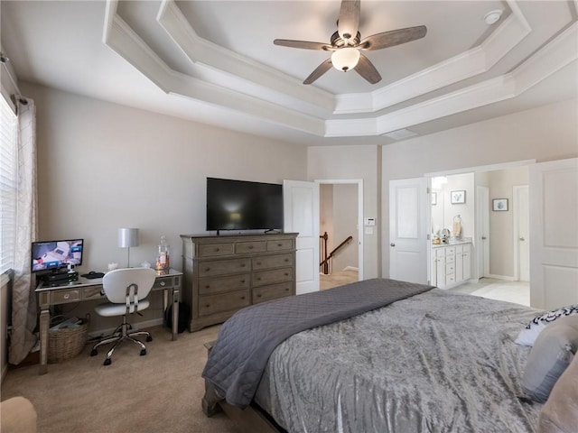 bedroom featuring a raised ceiling, light colored carpet, ornamental molding, and a ceiling fan