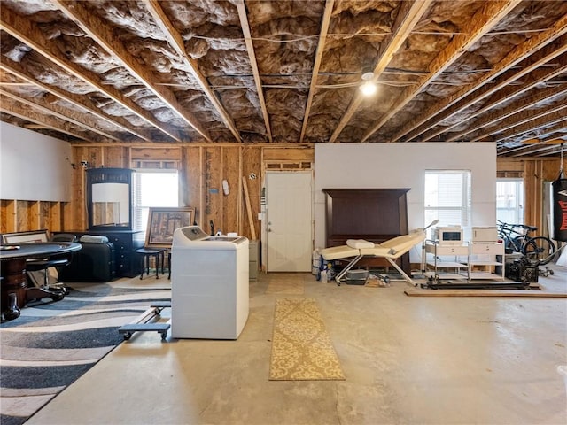 misc room featuring washer / dryer and concrete floors