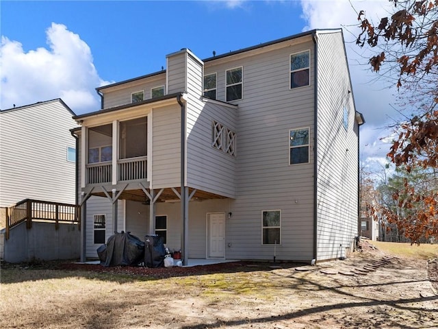 rear view of house with a sunroom