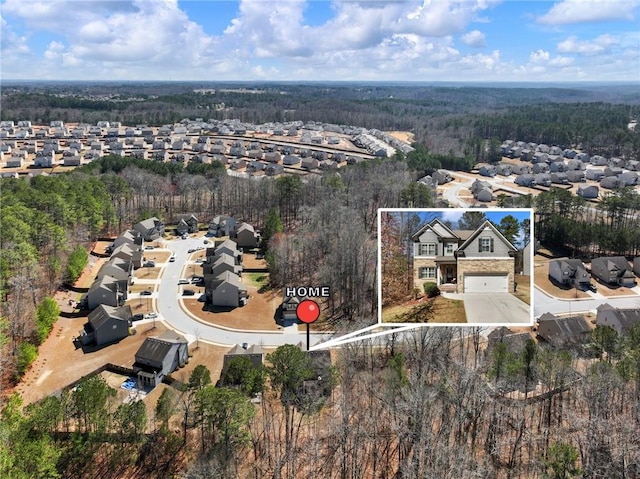 aerial view featuring a forest view