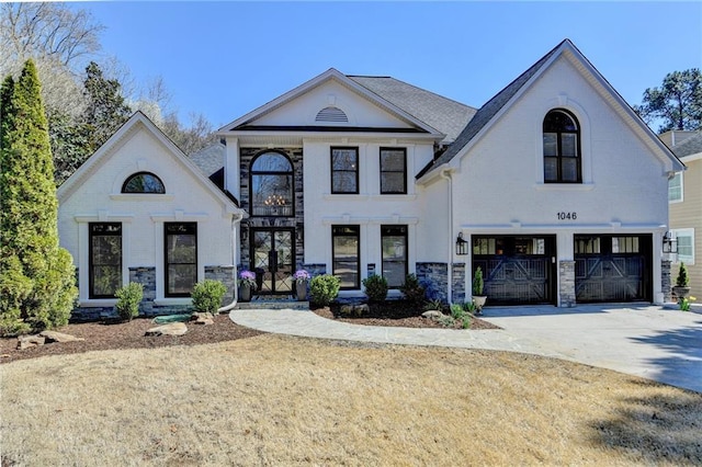 view of front of property with a garage, brick siding, and driveway