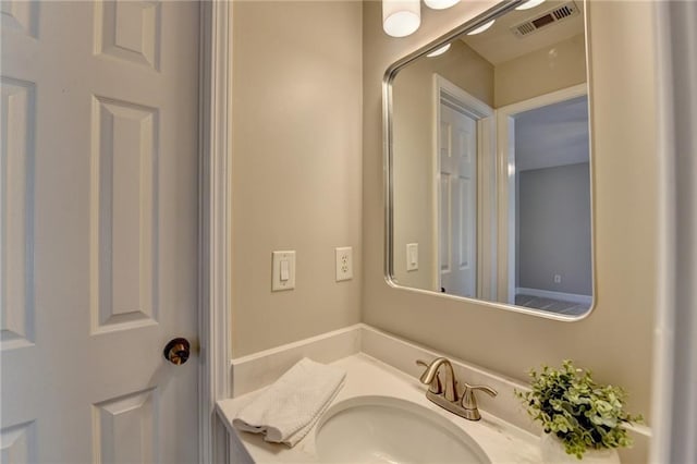 bathroom featuring visible vents and vanity