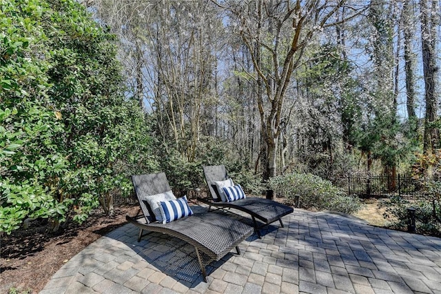 view of patio / terrace featuring fence