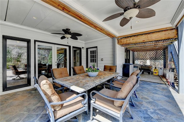 view of patio / terrace featuring a ceiling fan, outdoor dining area, and french doors