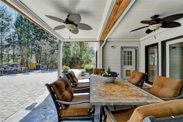 view of patio / terrace featuring outdoor dining space and a ceiling fan