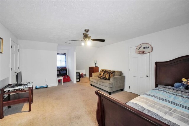 laundry room with washing machine and dryer, cabinets, and a textured ceiling