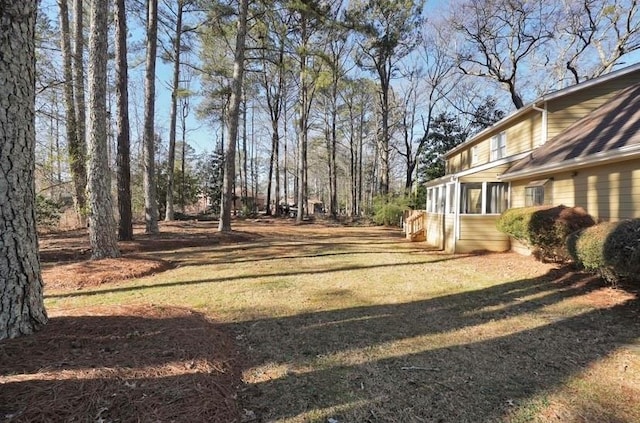 view of yard featuring a sunroom