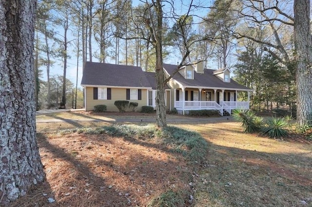 view of front of house featuring a front yard and a porch