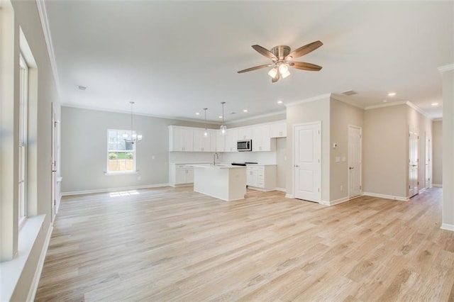 unfurnished living room with sink, light hardwood / wood-style floors, ceiling fan with notable chandelier, and ornamental molding