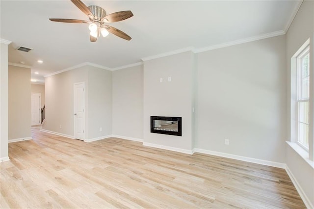 unfurnished living room featuring ceiling fan, light hardwood / wood-style floors, and crown molding