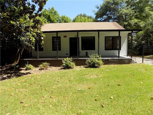 view of front of house featuring a front yard and covered porch