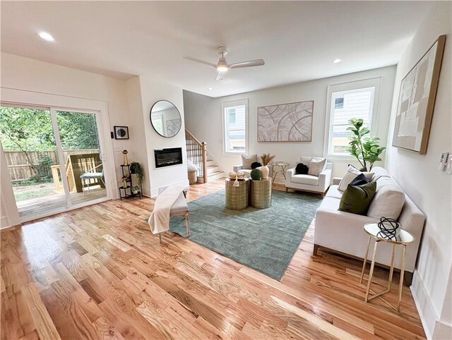 224 Cambridge Ave, Decatur, GA 30030 - living room with healthy amount of natural light, light wood-style flooring, recessed lighting, a ceiling fan, and stairs