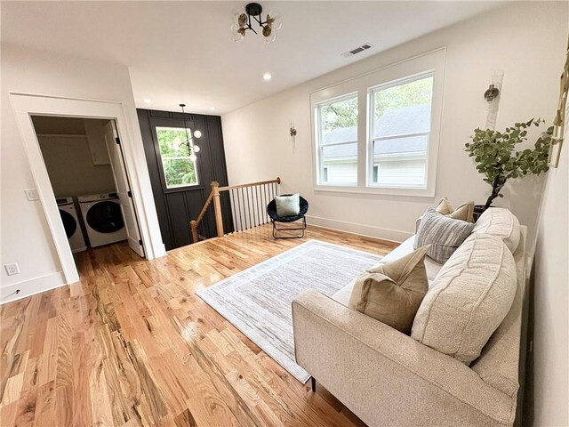 224 Cambridge Ave, Decatur, GA 30030 - living room featuring stairs, a glass covered fireplace, wood finished floors, and baseboards