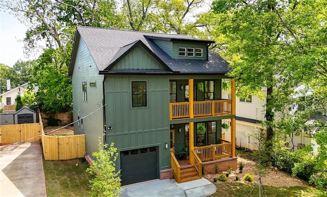 224 Cambridge Ave, Decatur, GA 30030 - view of front of house with board and batten siding, a balcony, a shingled roof, a gate, and an attached garage