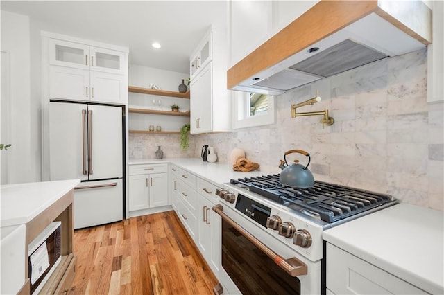 224 Cambridge Ave, Decatur, GA 30030 - kitchen with white appliances, premium range hood, open shelves, white cabinetry, and light countertops