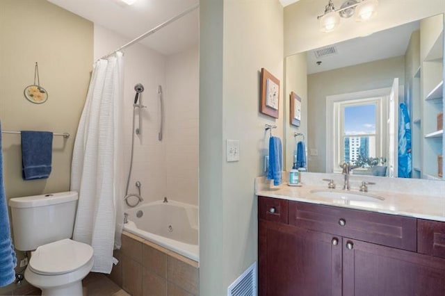 full bathroom featuring tiled shower / bath combo, visible vents, toilet, and vanity