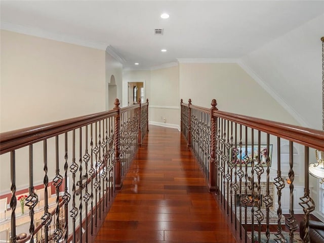 corridor with dark wood-type flooring and ornamental molding