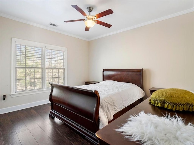 bedroom featuring ceiling fan, ornamental molding, and dark hardwood / wood-style flooring