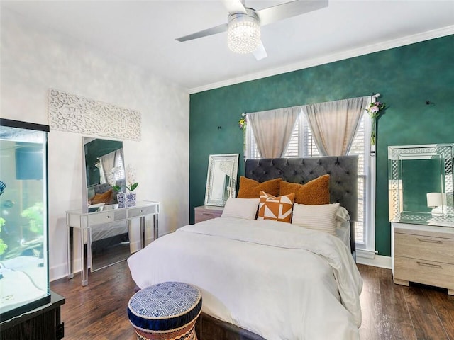 bedroom featuring crown molding, ceiling fan, and dark hardwood / wood-style floors