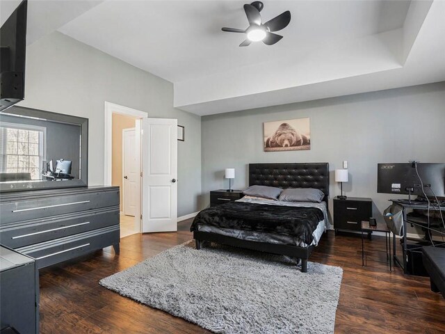 bedroom featuring ceiling fan and dark wood-type flooring