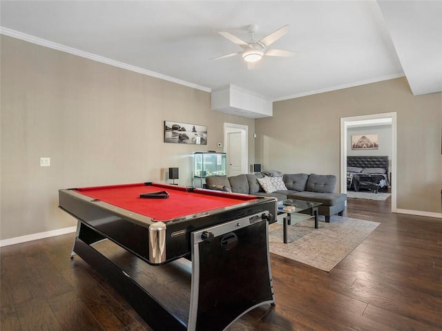 rec room with pool table, crown molding, ceiling fan, and dark wood-type flooring