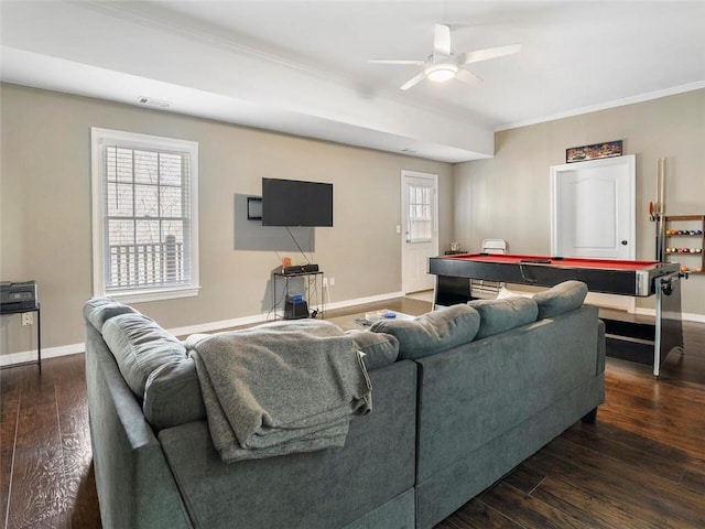 living room with ceiling fan, crown molding, dark hardwood / wood-style flooring, and a wealth of natural light