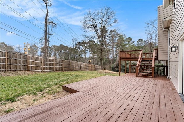 wooden deck with a yard