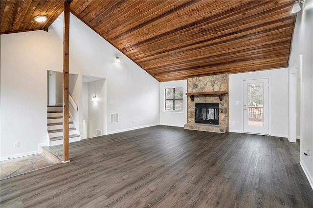 unfurnished living room with dark hardwood / wood-style flooring, a stone fireplace, high vaulted ceiling, and wood ceiling