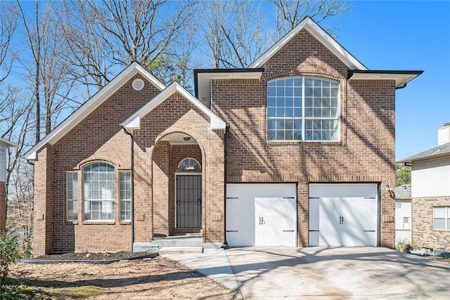 view of front of property featuring driveway, a garage, and brick siding