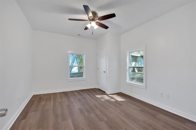 5361 N Main St, Acworth, GA 30101 - empty room featuring visible vents, baseboards, a ceiling fan, and dark wood finished floors