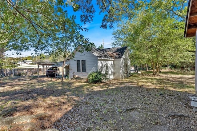 5361 N Main St, Acworth, GA 30101 - view of side of home featuring a carport and fence