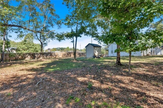 5361 N Main St, Acworth, GA 30101 - view of yard featuring a storage shed, fence, and an outdoor structure