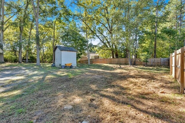 5361 N Main St, Acworth, GA 30101 - view of yard featuring an outbuilding, a fenced backyard, and a storage unit