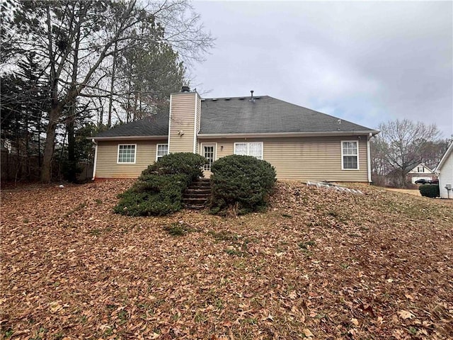 view of side of property featuring a chimney