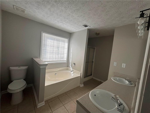 bathroom featuring tile patterned flooring, a sink, and visible vents