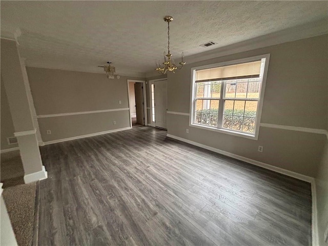 interior space featuring dark wood finished floors, visible vents, an inviting chandelier, a textured ceiling, and baseboards