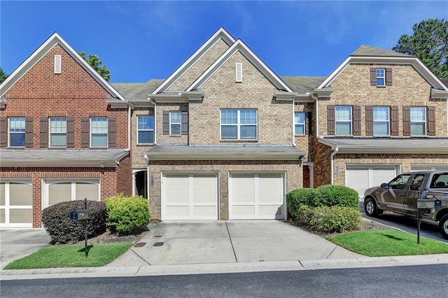 3351 Vintage Cir SE, Smyrna, GA 30080 - townhome / multi-family property featuring driveway, an attached garage, and brick siding