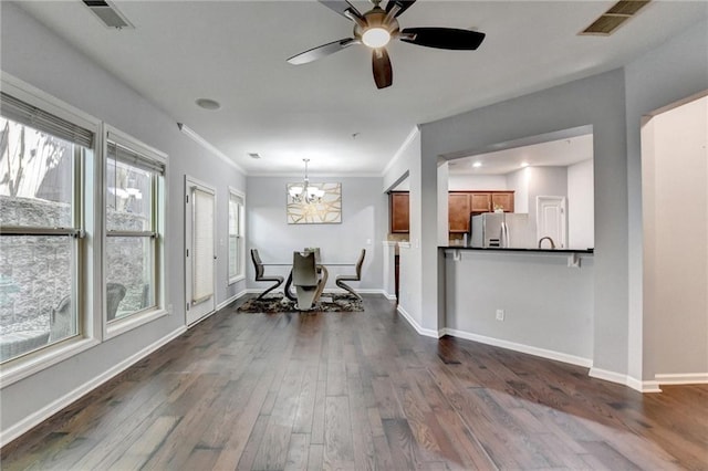 3351 Vintage Cir SE, Smyrna, GA 30080 - kitchen featuring stainless steel refrigerator with ice dispenser, brown cabinets, dark wood finished floors, dark countertops, and a chandelier