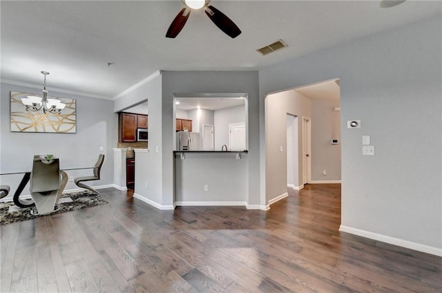 3351 Vintage Cir SE, Smyrna, GA 30080 - dining space with ceiling fan, dark wood-style flooring, a chandelier, baseboards, and crown molding